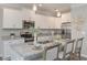 Bright kitchen with white cabinets, granite counters, and stainless steel appliances at 2960 Fareed St, Douglasville, GA 30135