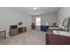 Neutral room with gray carpet, wooden cabinet, desk, chair and dark blue display table at 2960 Fareed St, Douglasville, GA 30135