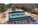 Aerial view of the pickleball courts, with six blue and green courts and parking at 330 Teal Ct, Roswell, GA 30076