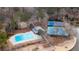 Aerial view of a community pool, tennis courts, and lake at 330 Teal Ct, Roswell, GA 30076
