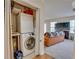 Convenient laundry closet featuring stacked washer and dryer, plus adjacent living area at 330 Teal Ct, Roswell, GA 30076