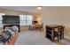 Living room with large window, desk space, and dining table at 330 Teal Ct, Roswell, GA 30076