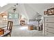 Bright bedroom featuring an iron bed frame and quaint window seating at 3555 Kingsboro Ne Rd, Atlanta, GA 30319