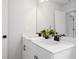 Bathroom with a double sink vanity, a large mirror, and modern black fixtures at 508 Red Terrace, Marietta, GA 30060