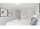Bright bedroom featuring plush carpet, neutral tones, and two modern art pieces framed in black hanging on the wall at 508 Red Terrace, Marietta, GA 30060