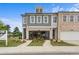 Attractive exterior view of modern townhomes with a well-manicured lawn and professional landscaping at 508 Red Terrace, Marietta, GA 30060