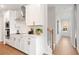 Bright kitchen featuring white cabinets, stainless steel appliances, and a stylish backsplash at 508 Red Terrace, Marietta, GA 30060