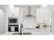 Stylish kitchen with stainless steel appliances, sleek cabinetry, and a quartz countertop island at 508 Red Terrace, Marietta, GA 30060
