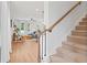 Staircase leading to a bright living room, showcasing wood floors and modern furnishings at 508 Red Terrace, Marietta, GA 30060