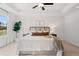 Bright main bedroom with large windows, a ceiling fan, and a tray ceiling at 508 Red Terrace, Marietta, GA 30060