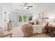 Bright main bedroom with large windows, a ceiling fan, and a tray ceiling at 508 Red Terrace, Marietta, GA 30060