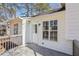 Charming backyard deck with a white painted home, perfect for outdoor enjoyment and relaxation at 155 Hitchcock Dr, Villa Rica, GA 30180