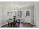 Cozy dining area with natural light, modern chandelier, and seating for four; perfect for intimate meals at 155 Hitchcock Dr, Villa Rica, GA 30180