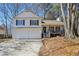 Charming two-story home featuring a covered front porch and a two-car garage at 155 Hitchcock Dr, Villa Rica, GA 30180