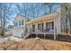 A charming house with a two-car garage and a cozy front porch at 155 Hitchcock Dr, Villa Rica, GA 30180