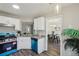 Efficient kitchen layout connecting to the dining area, with modern appliances and ample counter space for cooking at 155 Hitchcock Dr, Villa Rica, GA 30180