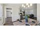 Open-concept living area seamlessly connecting the dining space to the kitchen, promoting a bright and airy feel at 155 Hitchcock Dr, Villa Rica, GA 30180