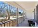 Inviting covered porch with comfortable seating and stylish railings at 155 Hitchcock Dr, Villa Rica, GA 30180