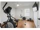 Home gym with hardwood floors and equipment including an elliptical trainer and rowing machine at 167 Atwood Nw Dr, Marietta, GA 30064