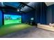 Indoor golf simulator room with comfortable seating and a large display screen at 2425 Peachtree Ne Rd # 1104, Atlanta, GA 30305