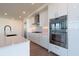 Modern kitchen with stainless steel appliances and a quartz countertop island at 2425 Peachtree Ne Rd # 1104, Atlanta, GA 30305