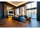 Modern lobby featuring herringbone floors, comfortable sofas and chairs, a bar area, and large windows at 2425 Peachtree Ne Rd # 1104, Atlanta, GA 30305