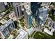 Aerial view of the property and surrounding cityscape with swimming pool and ample parking at 1080 Peachtree Ne St # 1909, Atlanta, GA 30309