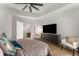 Bright bedroom featuring light-colored floors, a ceiling fan, and a view into the bathroom at 1080 Peachtree Ne St # 1909, Atlanta, GA 30309