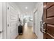 Welcoming entryway with modern accents leads into an open-concept living space and kitchen at 1080 Peachtree Ne St # 1909, Atlanta, GA 30309