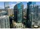 Modern glass high-rise with rooftop pool and garden surrounded by downtown buildings at 1080 Peachtree Ne St # 1909, Atlanta, GA 30309