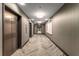 Well-lit hallway featuring sleek elevators and decorative wall accents, leading to apartment residences at 1080 Peachtree Ne St # 1909, Atlanta, GA 30309