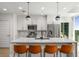 Modern kitchen featuring a quartz countertop island, stainless steel appliances, and sleek pendant lighting at 1080 Peachtree Ne St # 1909, Atlanta, GA 30309
