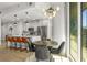 Open kitchen with a large island, stainless steel appliances, and a dining area with city views at 1080 Peachtree Ne St # 1909, Atlanta, GA 30309