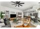 Spacious open-concept living area with modern furnishings, hardwood floors, and a kitchen and dining area at 1080 Peachtree Ne St # 1909, Atlanta, GA 30309