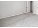 Bedroom featuring plush carpeting and two closets at 122 S Mill Creek Ct, Woodstock, GA 30188