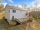 Two-story home with white siding, a walkout basement, and wooden decks on a sloped lot at 122 S Mill Creek Ct, Woodstock, GA 30188