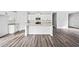 Bright, eat-in kitchen with granite counters, stainless appliances, and center island at 122 S Mill Creek Ct, Woodstock, GA 30188