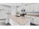 Close-up of eat-in kitchen with granite counters, stainless appliances, and center island at 122 S Mill Creek Ct, Woodstock, GA 30188