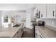Bright kitchen with granite counters, stainless appliances, and center island at 122 S Mill Creek Ct, Woodstock, GA 30188