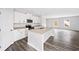 Bright, eat-in kitchen with granite counters, stainless appliances, and center island at 122 S Mill Creek Ct, Woodstock, GA 30188