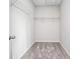 Walk-in closet with shelving and carpeting at 122 S Mill Creek Ct, Woodstock, GA 30188