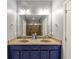 Bathroom boasts double sinks, a large mirror, and a neutral color scheme for a clean and functional design at 1222 Poston Se Pl, Smyrna, GA 30080