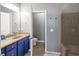 This bathroom features a double vanity, a separate toilet area, and a tiled shower at 1222 Poston Se Pl, Smyrna, GA 30080