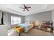 Large bedroom with tray ceilings, a fan, and a make up vanity at 1222 Poston Se Pl, Smyrna, GA 30080