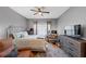 Comfortable bedroom with a ceiling fan, natural light, and hardwood flooring at 1222 Poston Se Pl, Smyrna, GA 30080