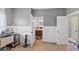 Bedroom featuring natural light, wainscotting, and doorways to bathroom and other living areas at 1222 Poston Se Pl, Smyrna, GA 30080