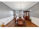 Bright dining room with wood floors, traditional furnishings, and natural light at 1222 Poston Se Pl, Smyrna, GA 30080