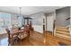 Elegant dining room featuring hardwood floors, stylish chandelier, and staircase at 1222 Poston Se Pl, Smyrna, GA 30080