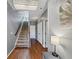Bright foyer with gleaming hardwood floors, staircase, chandelier, and elegant decor at 1222 Poston Se Pl, Smyrna, GA 30080
