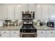 Well-equipped kitchen featuring stainless steel appliances and granite countertops at 1222 Poston Se Pl, Smyrna, GA 30080